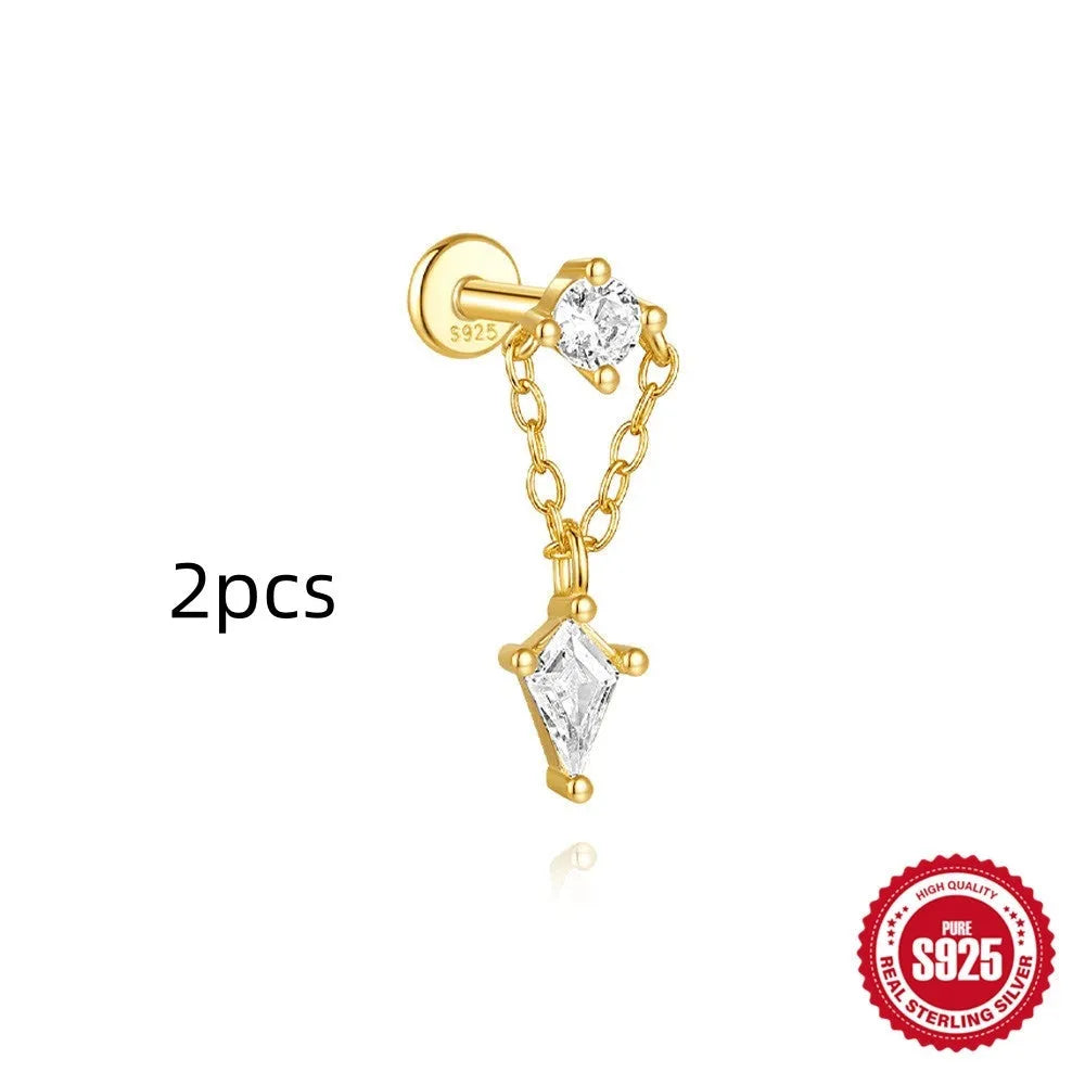 Geometric kite-shaped sterling silver earrings with a gold electroplated chain tassel featuring rhinestones.