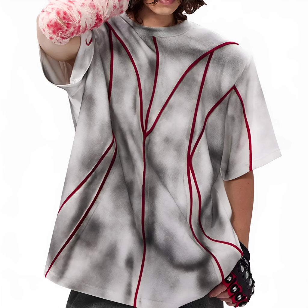 Short sleeve t-shirt with padded shoulders and three-dimensional line patchwork design on a round neck.