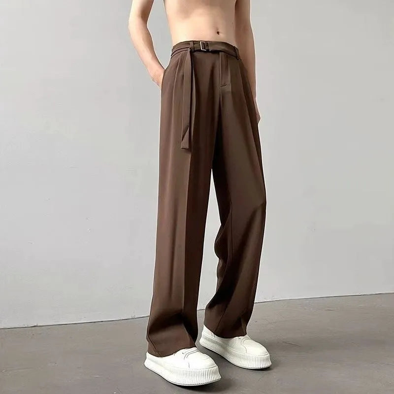 Black wide leg straight trousers with a loose casual fit on a hanger.