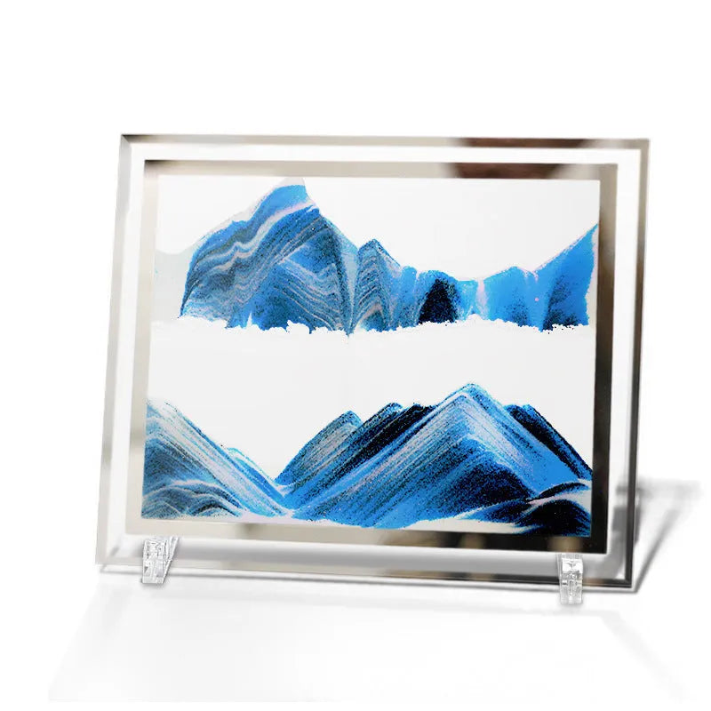 Glass quicksand painting ornament with geometric shape showing landscape sand art in black and white green colours.