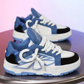 Men's white thick-bottom clunky sneakers with a round toe and lace-up front.