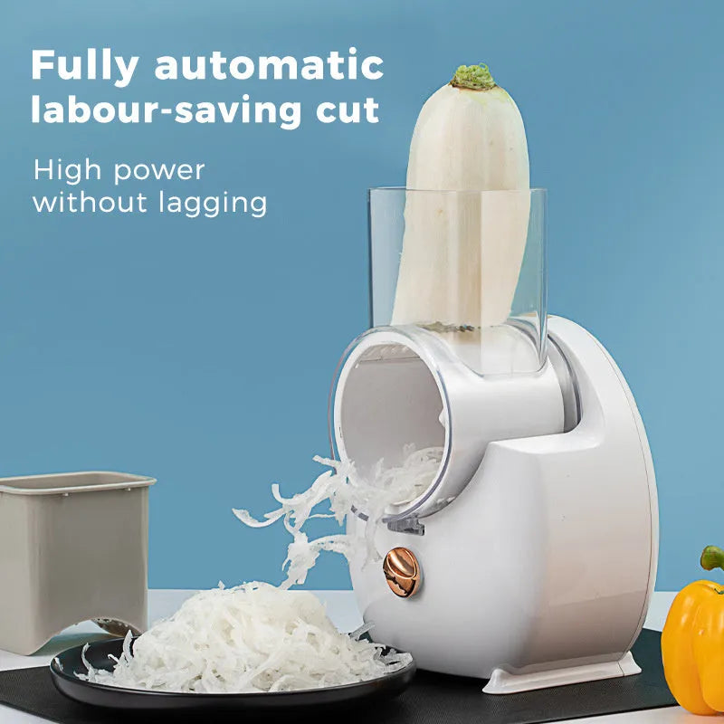White electric vegetable slicer with rotary grater, suction base, and multiple blades on kitchen counter