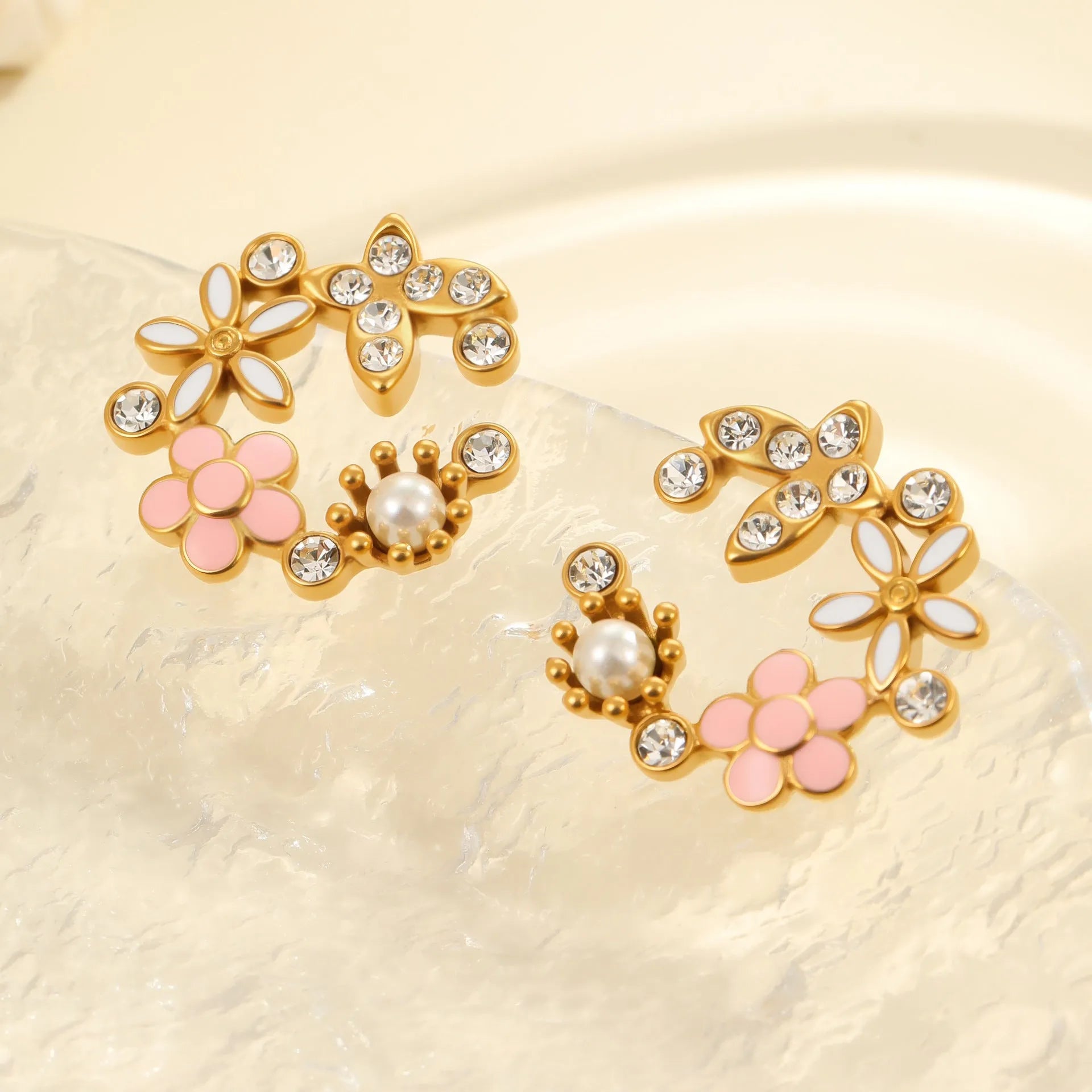 Women's floral stud earrings with petal design in electroplated finish on stainless steel