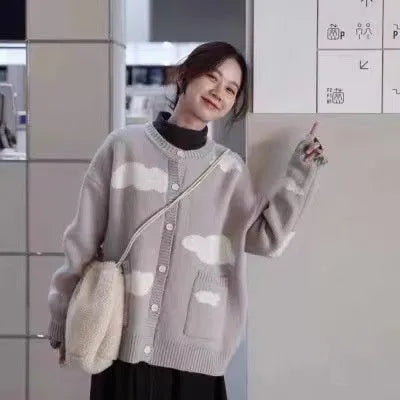 Blue cloud pattern women's loose cardigan sweater with long sleeves on hanger