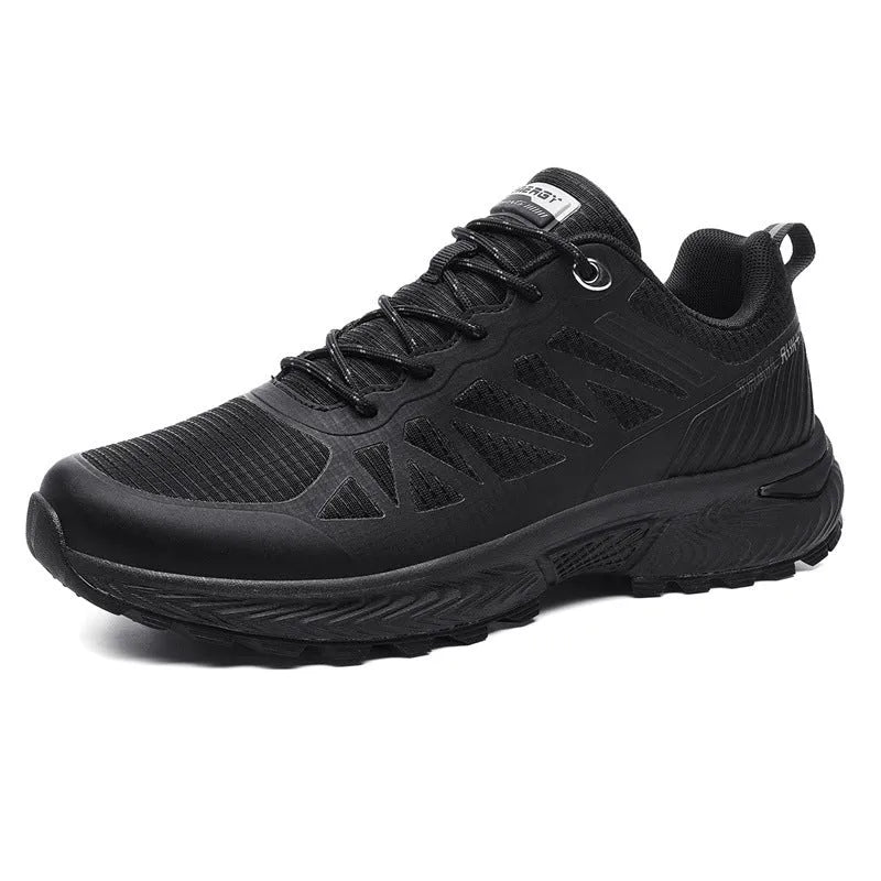 Men's black and orange mesh outdoor running shoe with round toe and flat heel on a rubber sole.