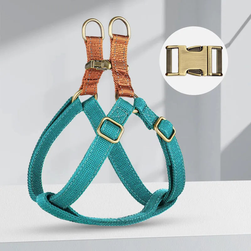 Brown vest-style dog harness on small dog showing cotton belt material and alloy fastener
