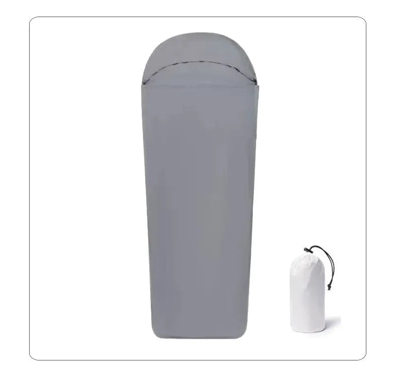 Blue mummy-type nylon camping sleeping bag for adults, laid out flat showing its tapered shape.
