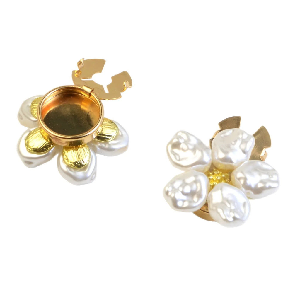 White alloy pearl rhinestone cufflink with electroplated finish and inlaid diamond setting on solid background