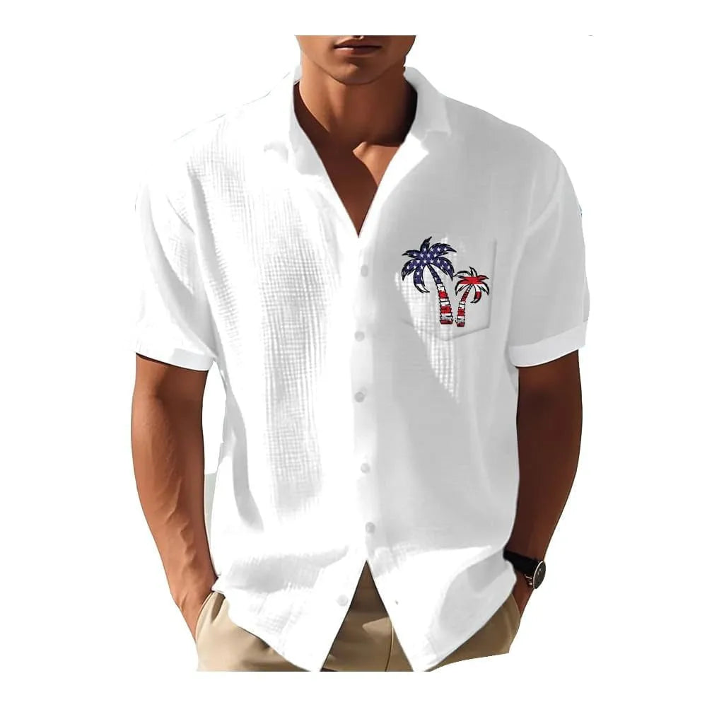 Man wearing a loose fit short sleeve shirt with a colourful digital Hawaiian print pattern.