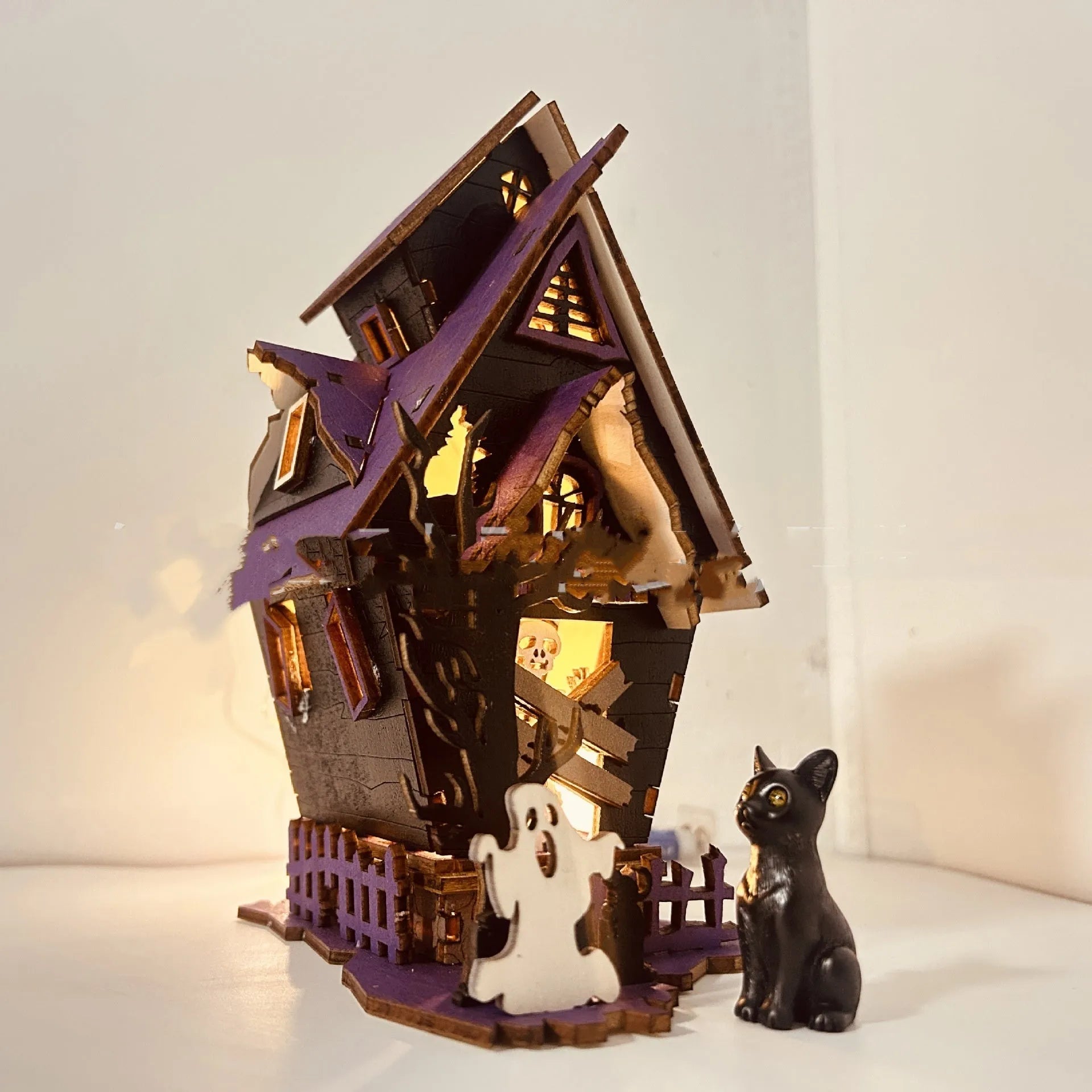 Wooden Halloween haunted house decoration with luminous paint finish, measuring 14x10.5x19cm