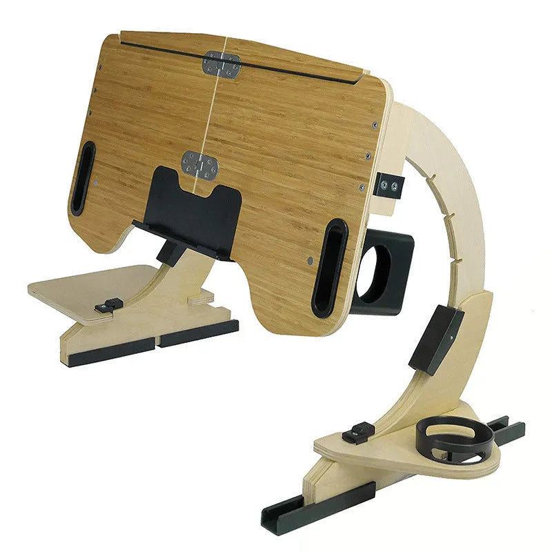 Wooden folding computer table on bed showing adjustable angle mechanism in white maple finish