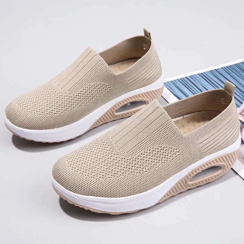 Women's mesh outdoor running shoes in beige colour with round toe design and air cushion