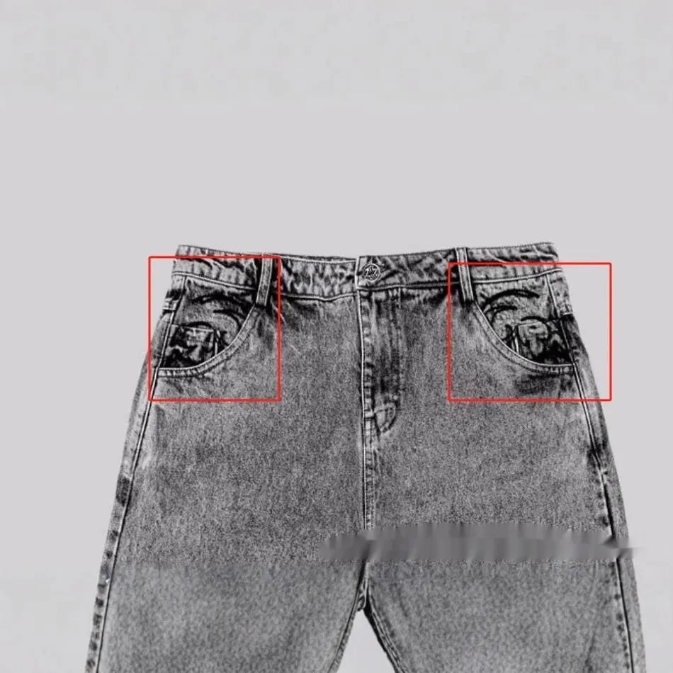 Grey loose straight-leg denim trousers with mid-waist styling on hanger