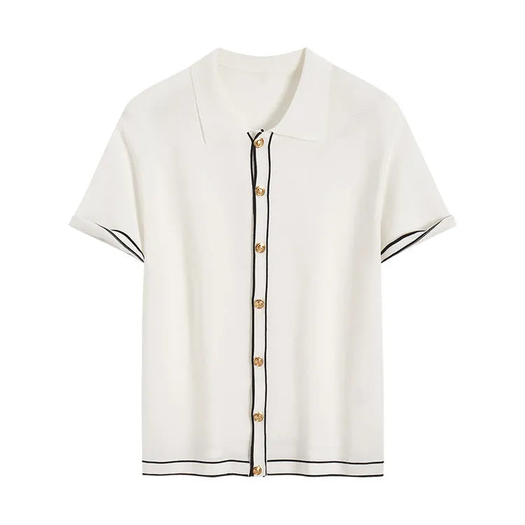White women's cardigan with dark contrast lapels and short sleeves laid flat