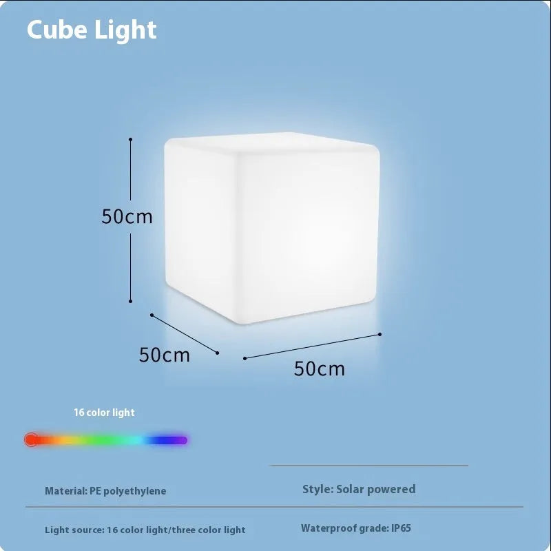 White square LED cube stool light for outdoor use, showing modern design with solar panel or charging port.