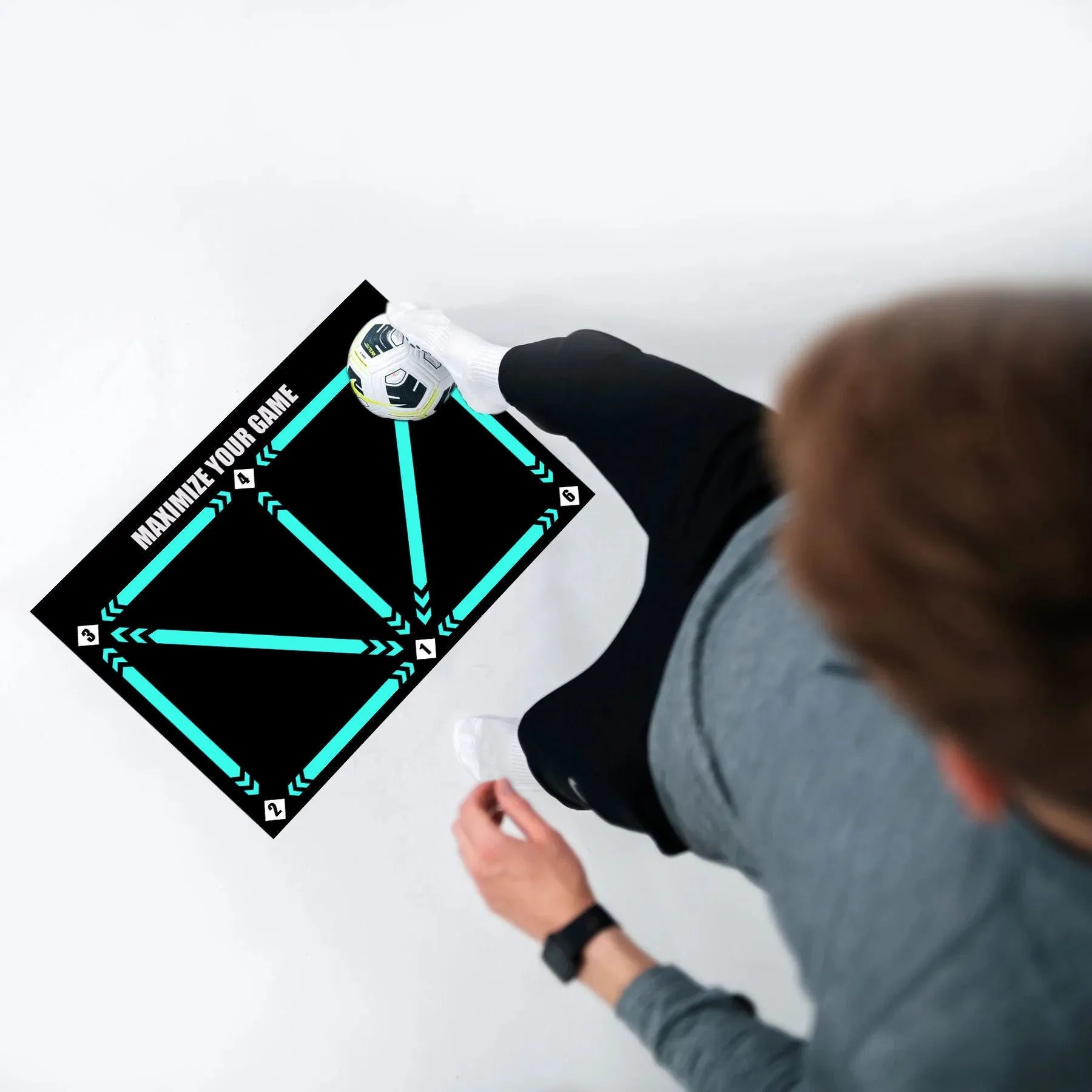 Black football training mat measuring 60 by 90 centimetres with a non-slip rubber base
