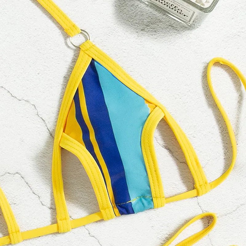 Yellow women's swimsuit with split skirt and hollow backless design.