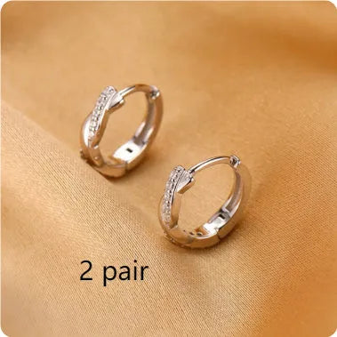 Interwoven hemp rope earrings with geometrical round shape in gold and silver colours