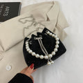 Women's soft PU light diamond decorated crossbody shoulder bag with chain strap in bucket shape.