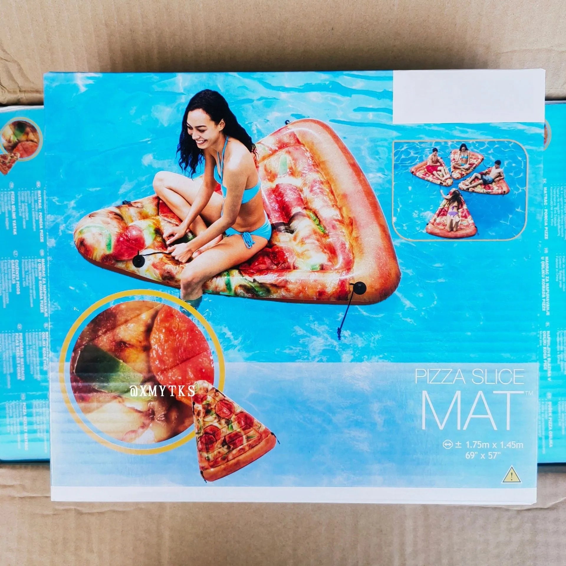 Pizza-shaped inflatable surfboard recliner floating on water, showing large 175cm size