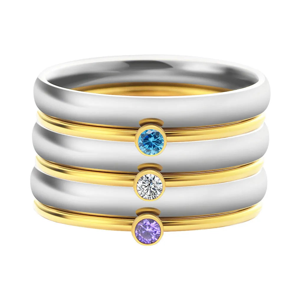 December colour birthstone engraved titanium steel ring with geometric design on a white background.