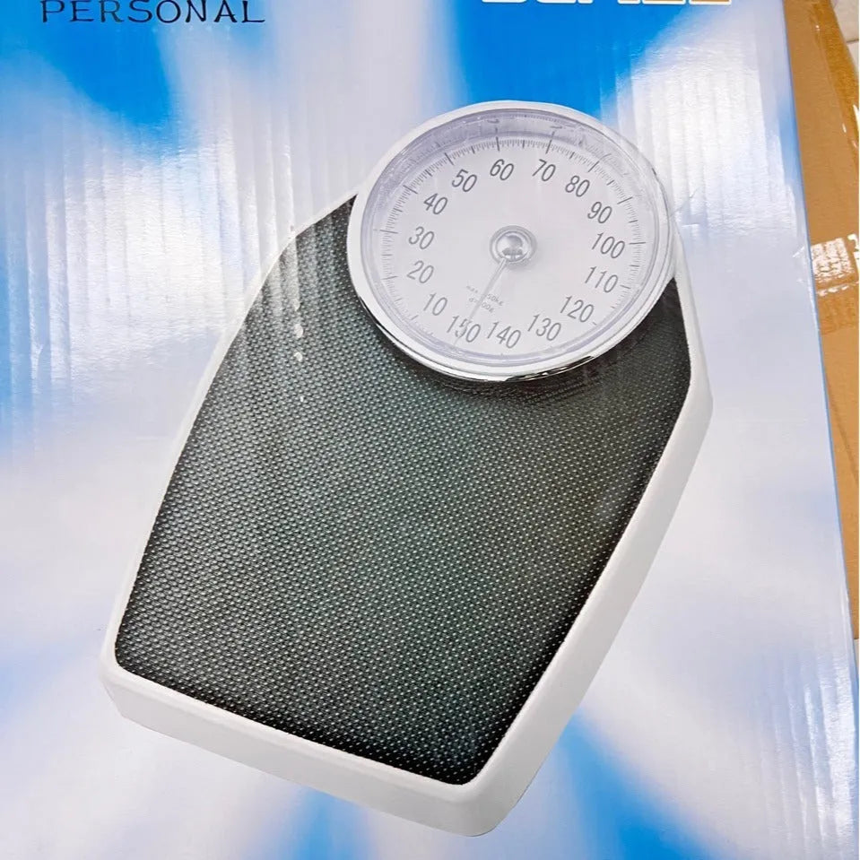 Black mechanical pointer body weight scale with large dial showing 180kg capacity