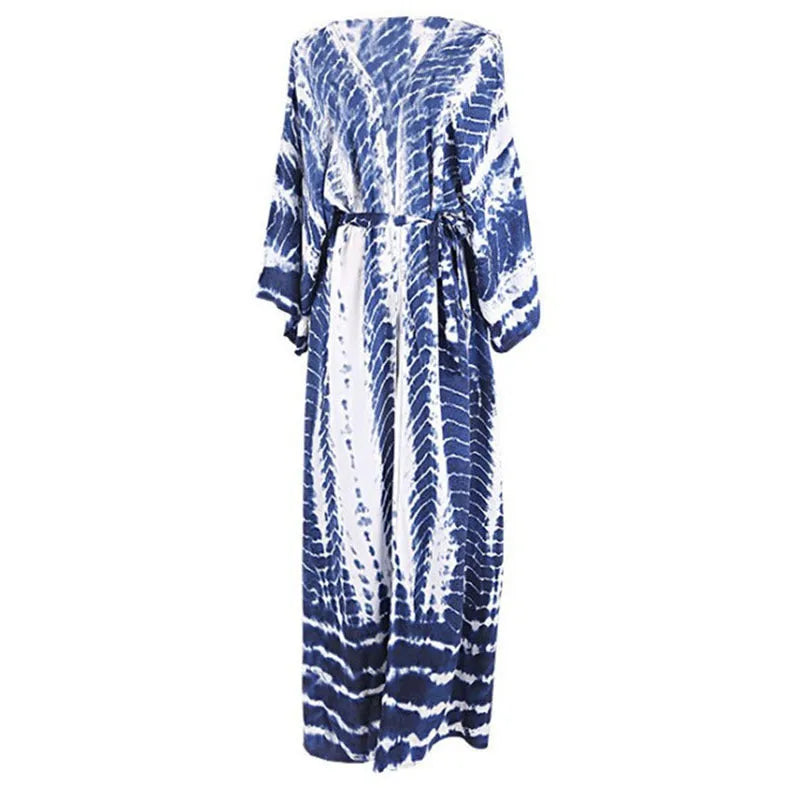 Woman wearing a printed cotton beach cover-up blouse in a DN0712 series colour.