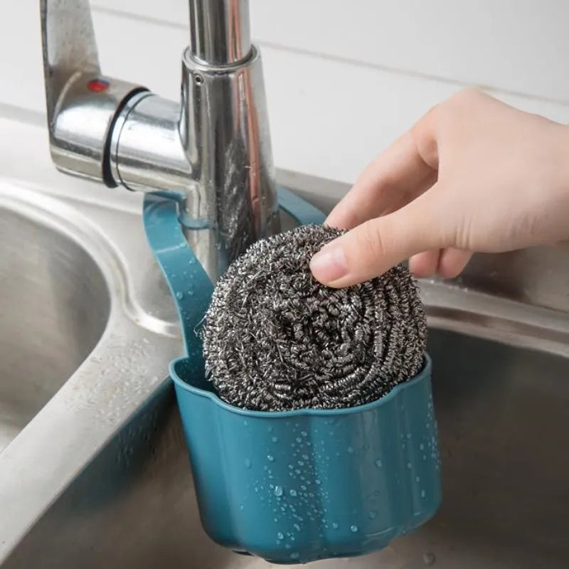 Plastic sink drain basket in Nordic style, shown in dark blue, measuring 20 cm long by 10 cm wide.