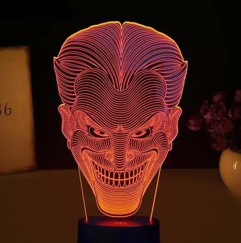 USB-powered 3D acrylic LED table lamp showing seven colour options on a desk