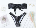 Black printed one-piece swimsuit with bikini print split tube top and backless design