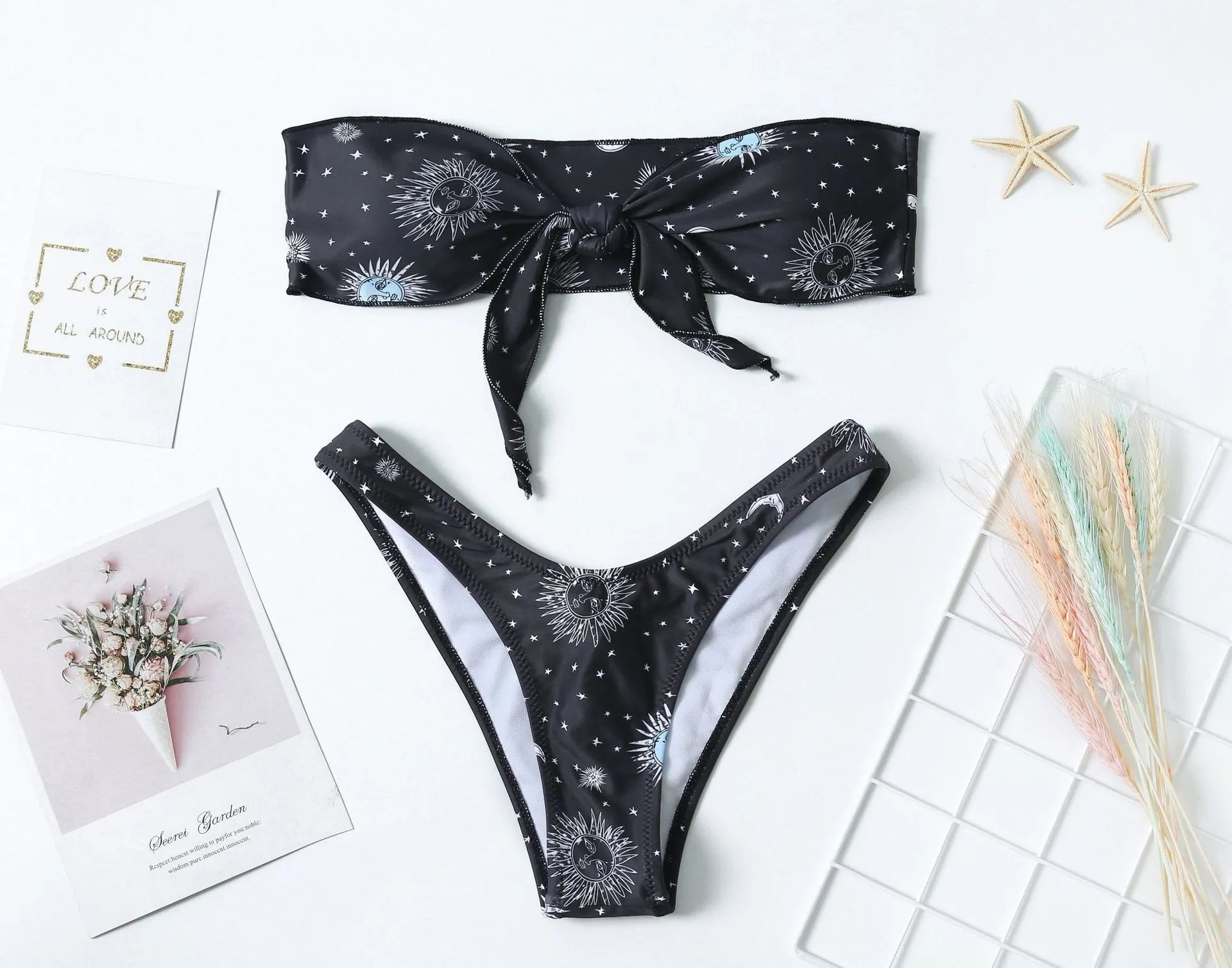 Black printed one-piece swimsuit with bikini print split tube top and backless design