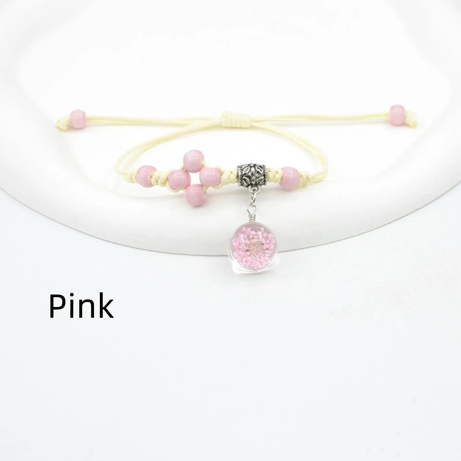 Glass dried flower bracelet with large 1.4cm beads containing real preserved flowers in hand-woven design