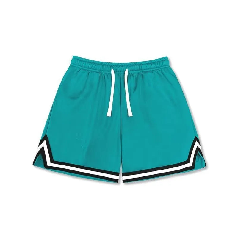 Man wearing loose grey sports shorts made from elastic polyester fabric.