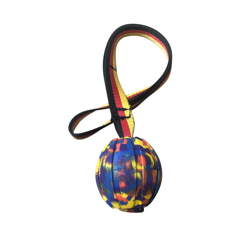 Floating camouflage and yellow EVA dog training balls with string tethers in three different sizes