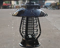 White solar powered outdoor mosquito repellent lamp with solar panel on top and LED light beads.