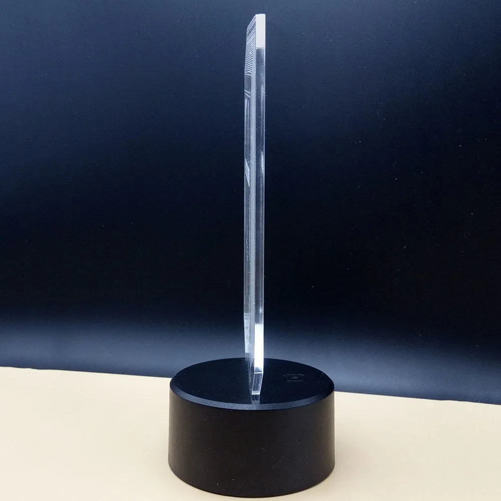 3D LED desk lamp with remote control showing colourful acrylic visual illusion design
