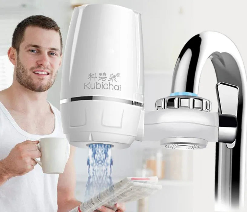 White plastic kitchen tap water filter with ceramic cartridge and installation adapters