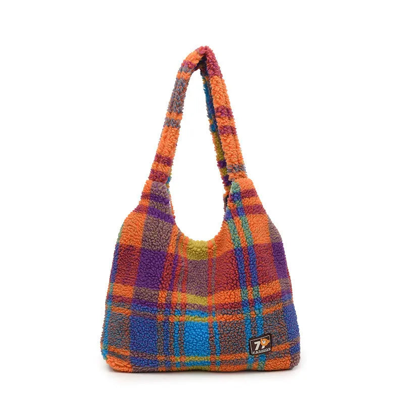 Women's plaid pattern crossbody tote bag showing soft plush material and horizontal square shape with crossbody strap.