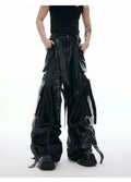 Men's black loose-fit quilted trousers with multiple pockets and heavy stitching