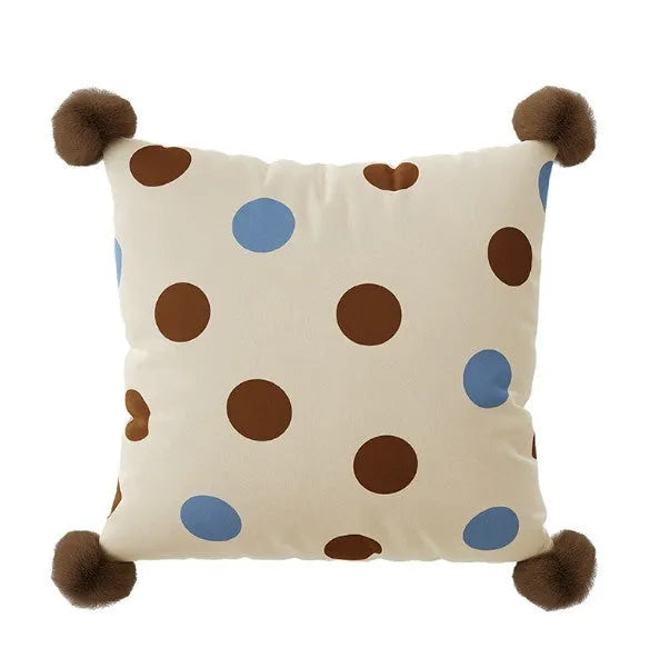 Blue cartoon animal print sofa cushion pillow on a grey sofa.