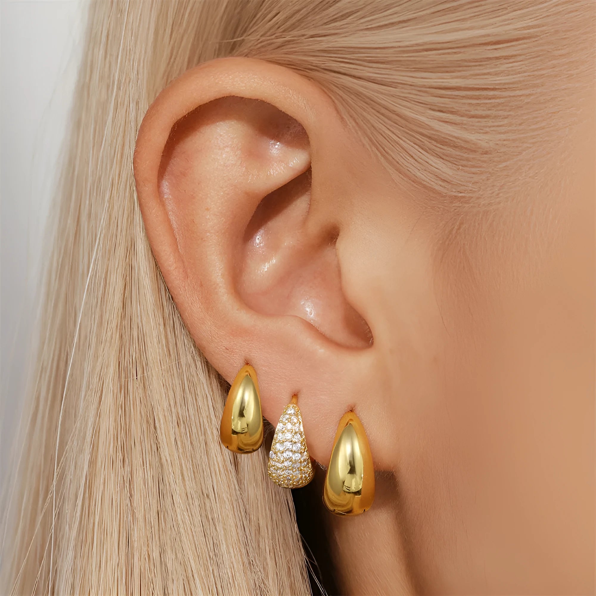 Golden electroplated brass earclip earrings with geometric round design