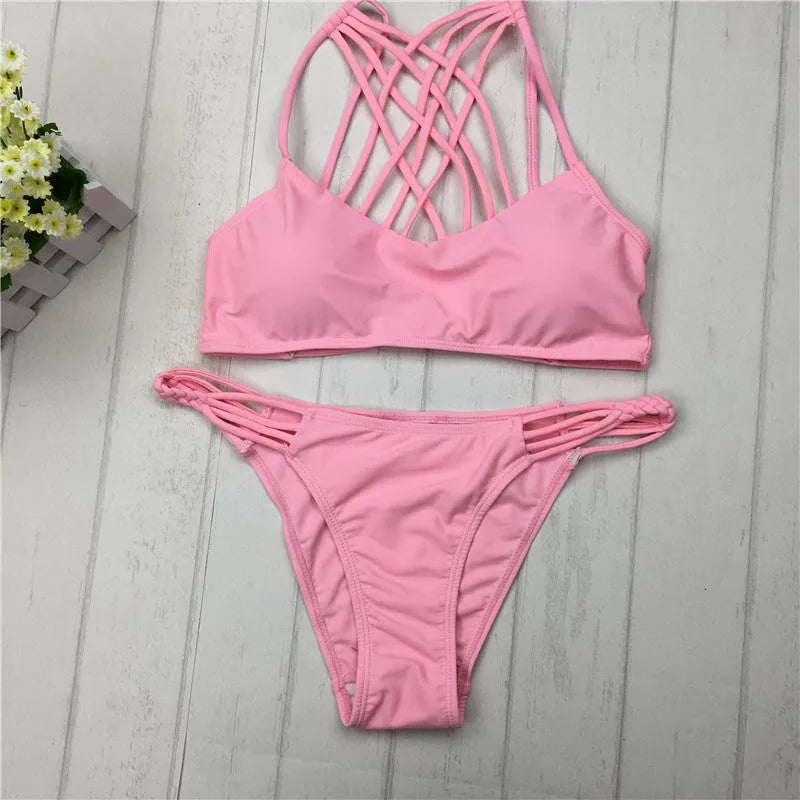 Women's pink bandage halter bikini swimsuit with cut out cross front design