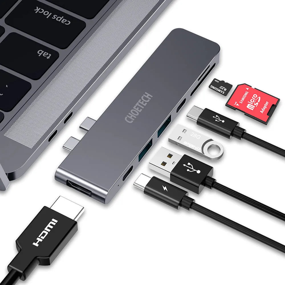 Aluminium USB-C adapter with SD card reader showing multiple ports including HDMI and USB 3.0