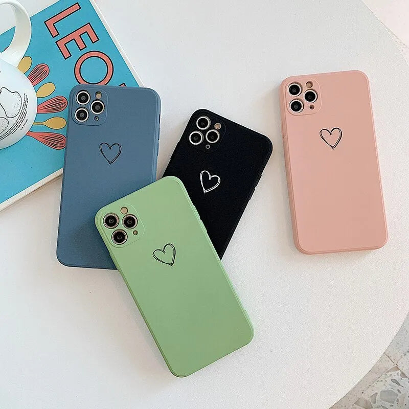 Silicone phone case for Apple iPhones in multiple solid colours including black, white, and pastel options
