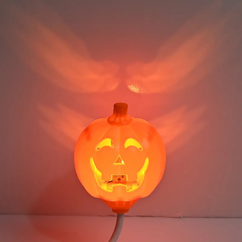 Plastic pumpkin lamp with USB charging cable in yellow or purple light colour