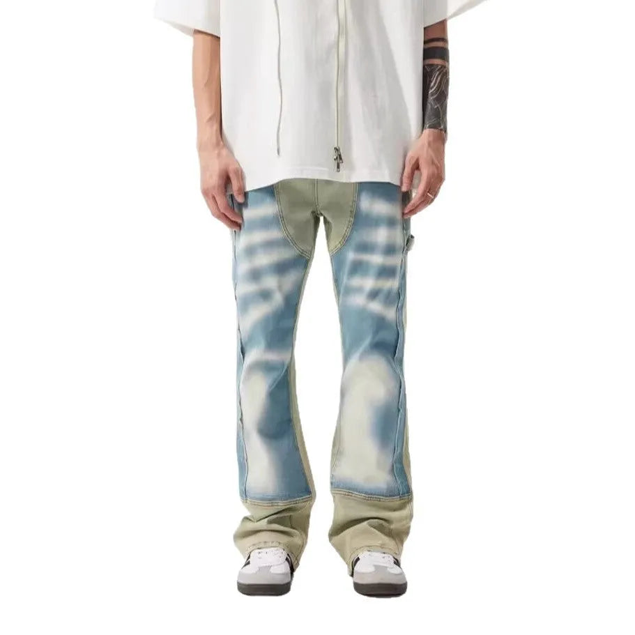 Yellow and blue retro patchwork distressed jeans on a model