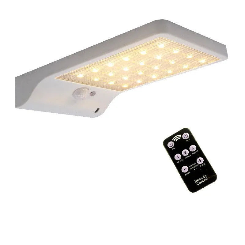 Black and white outdoor solar-powered garden light with IP65 waterproof rating for courtyards and balconies.