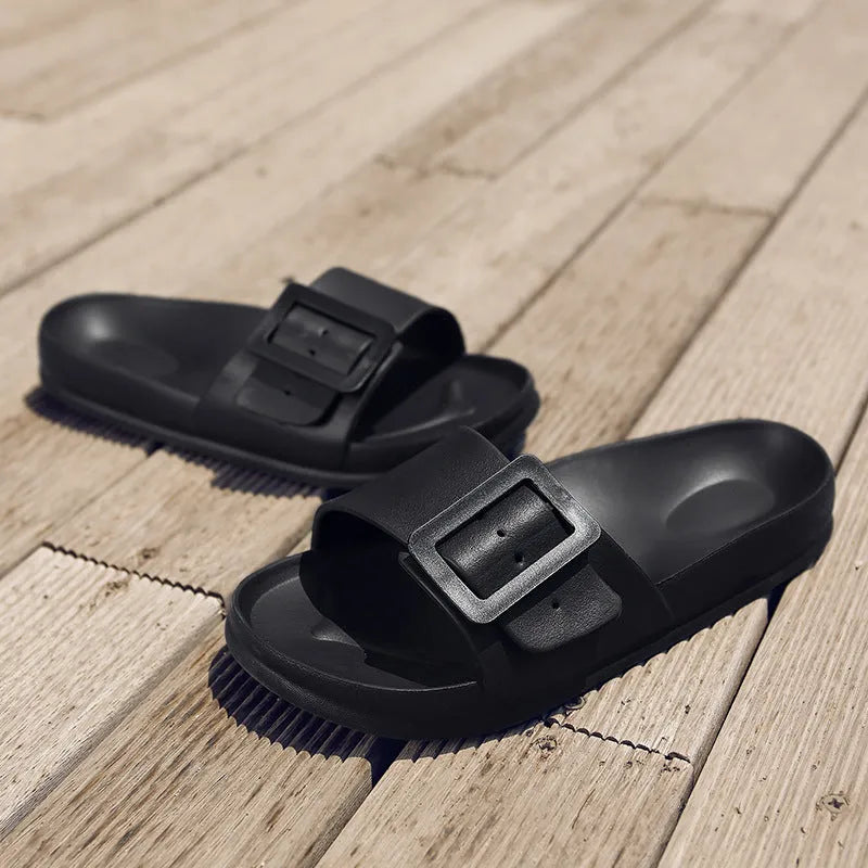 Women's grey blue EVA flip-flops with a buckle strap on a soft sole.