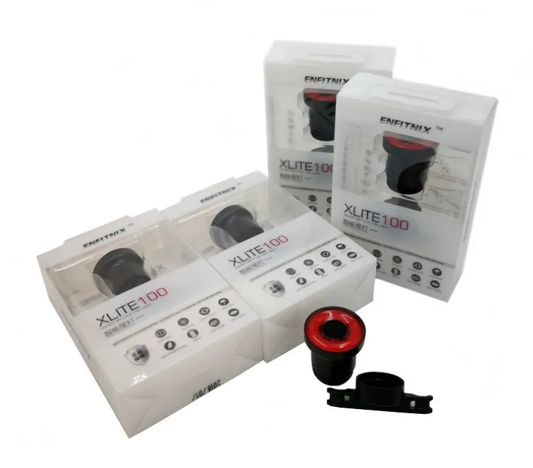 ENFITNIX Xlite100 bicycle taillight with 6061 aluminium chassis, mounted on seat rail, black body with red lens