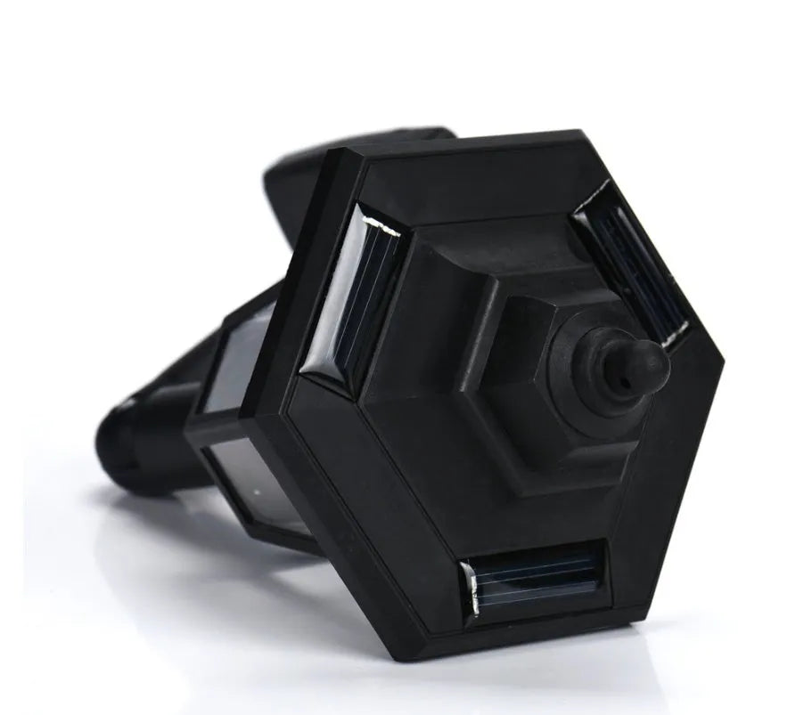 Black hexagonal solar wall lamp with light sensor mounted on an outdoor wall